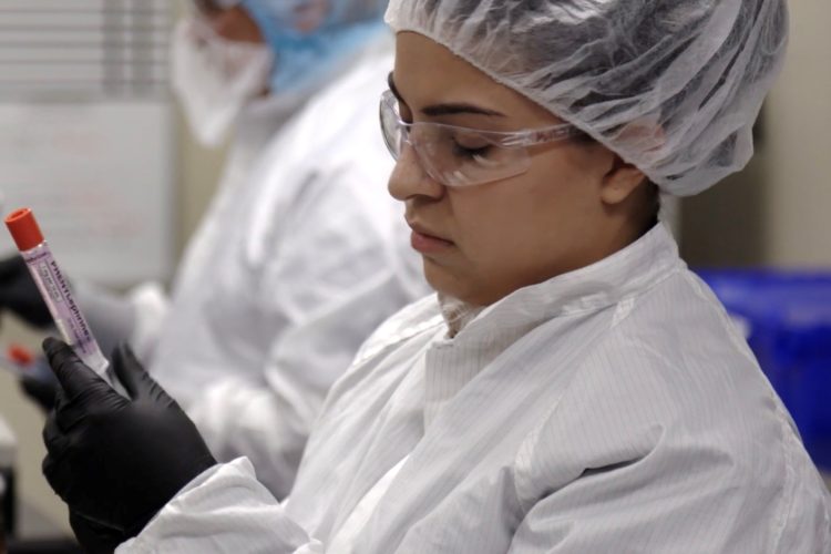 doctor looking at a vial